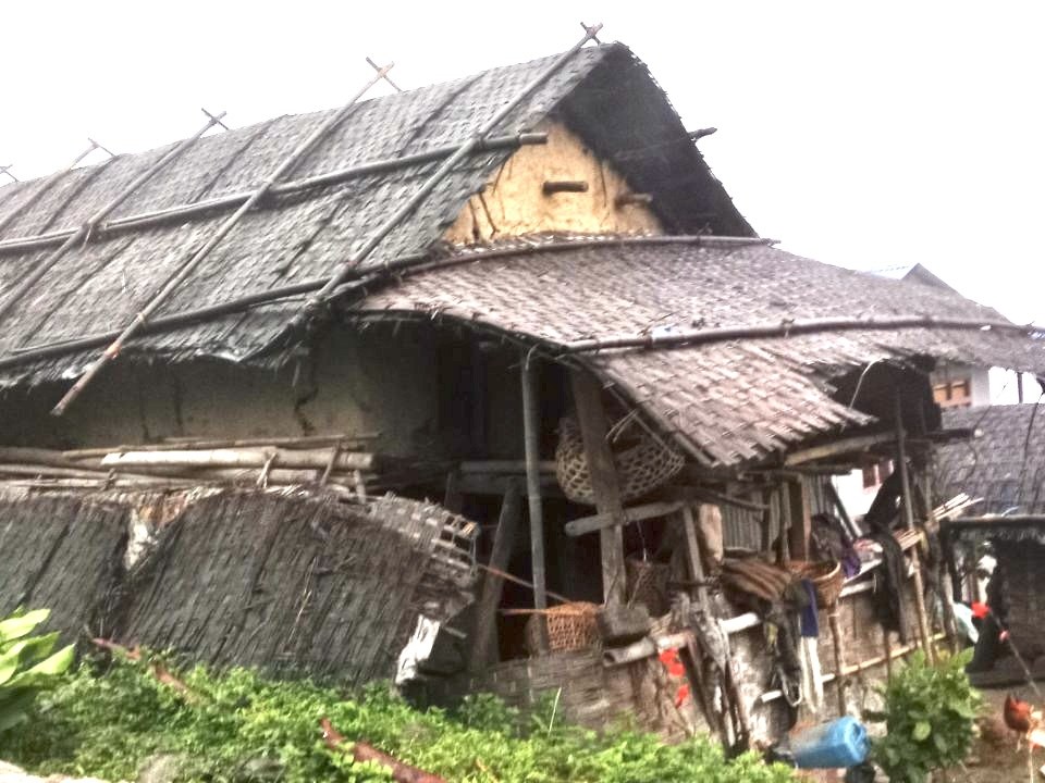 A worn thatched house before reconstruction